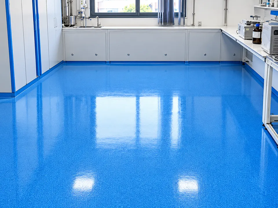 Glossy blue resin floor in clean technical/laboratory room