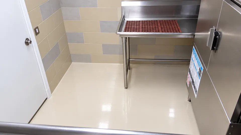 Light beige seamless floor in clean processing/service room