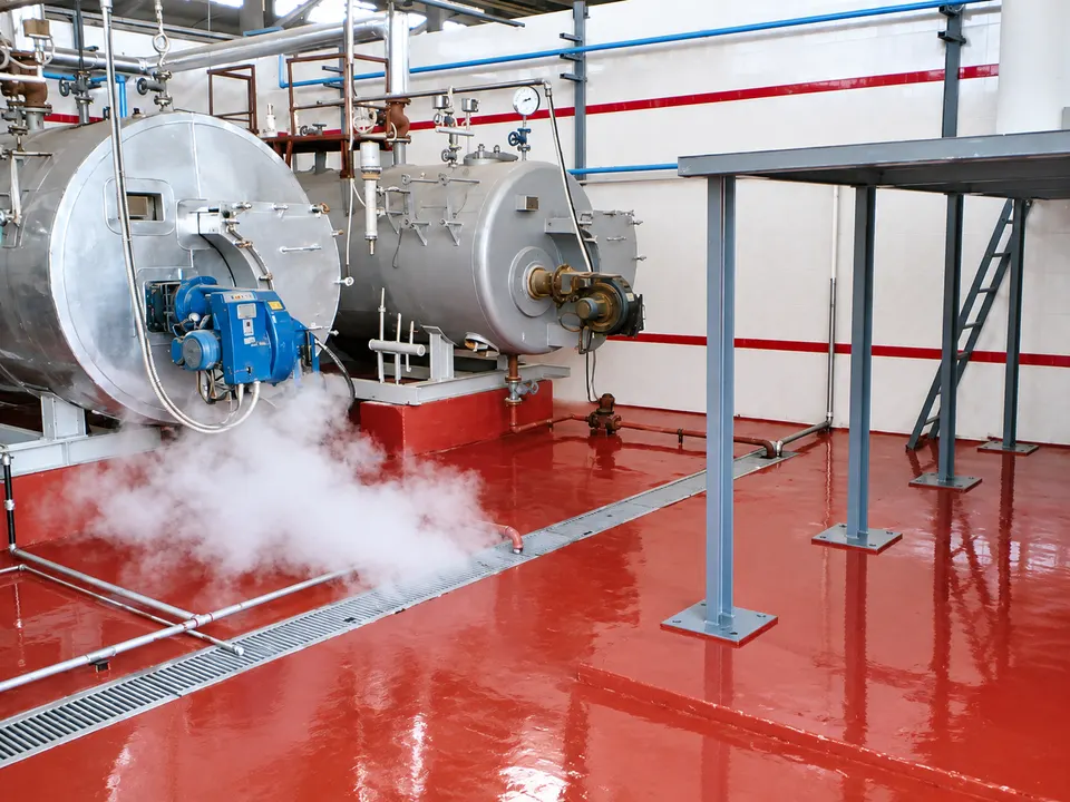 Red industrial/mechanical-room resin floor around boilers
