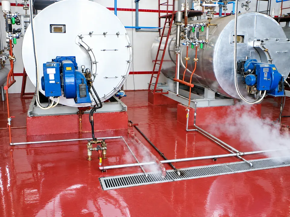 Red industrial/mechanical-room resin floor with equipment