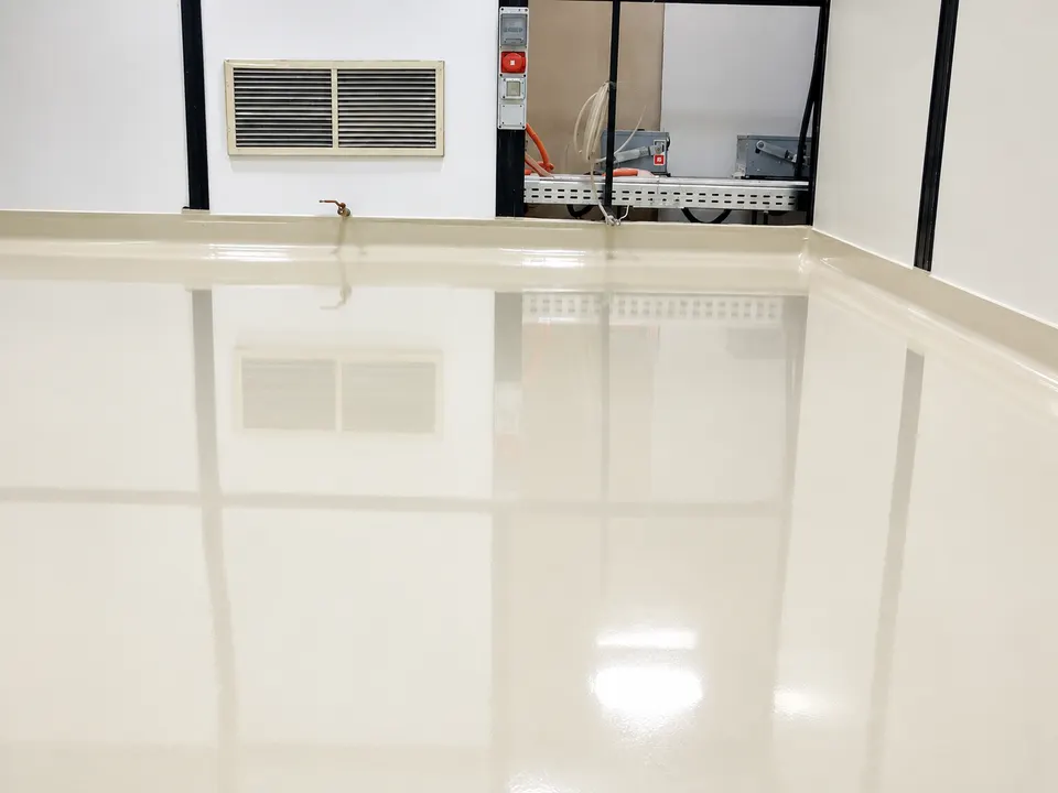 Light beige highly reflective floor in clean interior